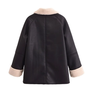 Chic black and white faux shearling jacket featuring contrast trim and oversized fit