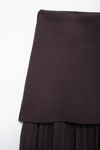 Detail of dark coffee knit rib fabric and pleated texture stitching for women's skirt