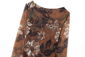 Detailed view of the sheer mesh fabric featuring an artistic vintage floral print pattern