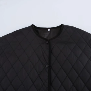 Women's black diamond quilted jacket with high-low hem and classic snap buttons
