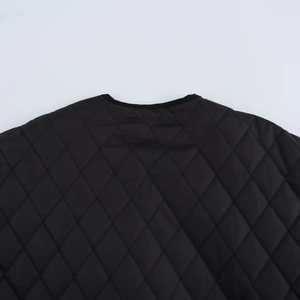 Women's black quilted jacket with diamond pattern and warm padded silhouette