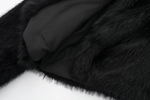 Close-up of black faux fur jacket with silky lining and exquisite stitching details