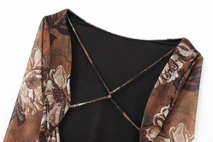 Detailed view of the back tie-up detail and vintage floral mesh fabric on the dress