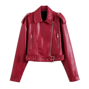 Close-up of red cropped faux leather biker jacket with metallic zippers and belt details