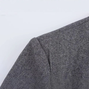 Women's melange grey wool blend suit jacket showing premium shoulder seam detail