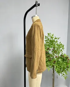 Detail showing side flap pocket and soft suede texture of the tan women blazer