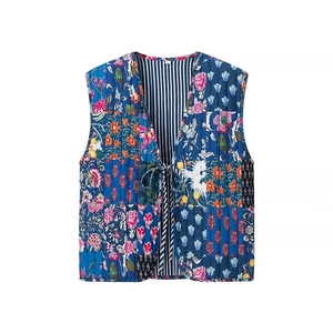 Detailed view of bohemian floral quilted vest featuring V-neck and tie-up front closure