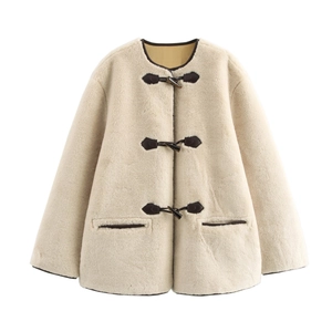 Close-up of cream white faux fur coat featuring elegant toggle closures and side pockets