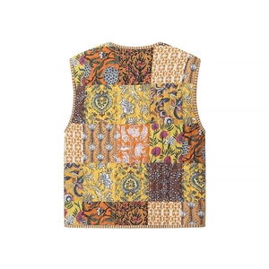 Detailed back view of a vintage quilted patchwork vest with vibrant floral ethnic patterns