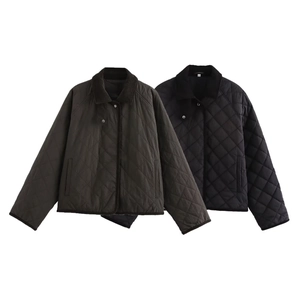Detail of diamond-quilted jackets in black and green with contrast corduroy collars