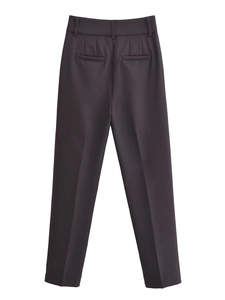 Detailed view of high waisted dress pants featuring symmetrical rear welt pockets and crisp seams