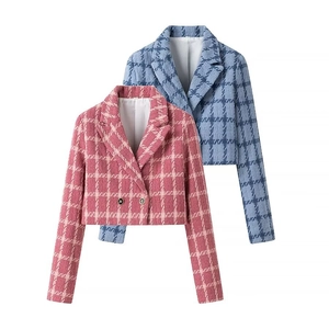 Detail of pink and light blue tweed plaid jackets with lapels and classic buttons