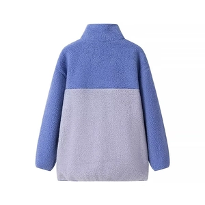 Detail view of the back of a purple and grey color-block sherpa fleece jacket with stand collar