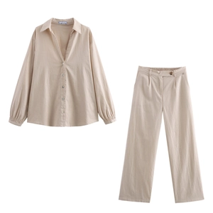 Detailed view of beige cotton linen long sleeve shirt and wide-leg trousers set
