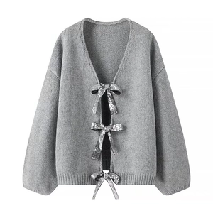 Grey knit cardigan for women with silver sequin bow ties and a deep V-neckline style