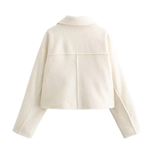 Back view of a cropped cream wool jacket featuring T-shaped stitching and a soft texture