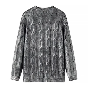 Women's silver metallic knit sweater featuring classic cable texture and crew neck style