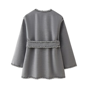 Back view of women's grey wool coat with elegant black and white woven tweed trim decor