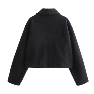 Detailed back view of a black short wool jacket featuring cross-stitch seam design