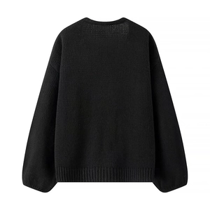 Rear view of black knit cardigan featuring a loose fit with ribbed cuffs and hemline