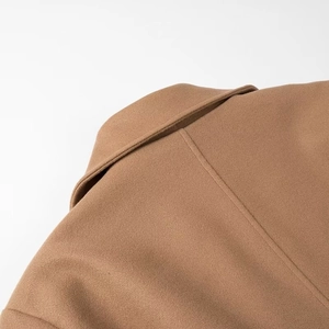 Elegant camel wool coat with classic lapel detail for a minimalist autumn look