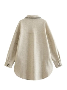 Detailed back view of oatmeal shacket featuring contrast stitching and curved hem