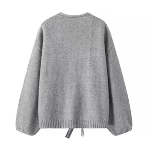 Back view of a grey knit cardigan sweater with round neck and ribbed hem on white background