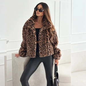 Detail shot of leopard print faux fur jacket with wide lapels and premium metal buttons