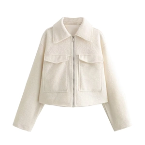 Women's white fuzzy cropped jacket with front zipper and flap pockets in flat lay view