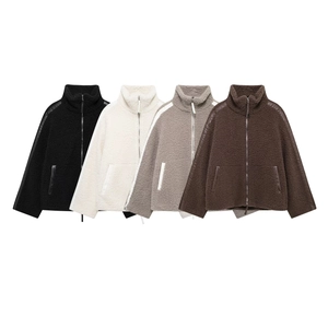 Detail of fleece jackets in four colors featuring contrast paneling and high neck design