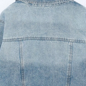 Classic light blue denim jacket for women showing back yoke stitching and washed texture