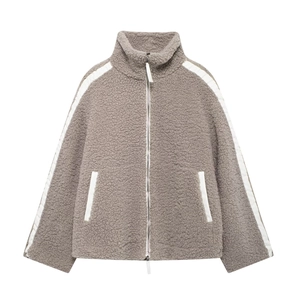 Detail of grey sherpa jacket showing high collar and silver zipper with white stripes