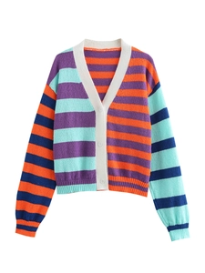 Detailed close-up of V-neck knitted cardigan showing multi-color stripes and button texture