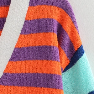 Loose V-neck striped knit cardigan in colorful orange, purple, and blue textures