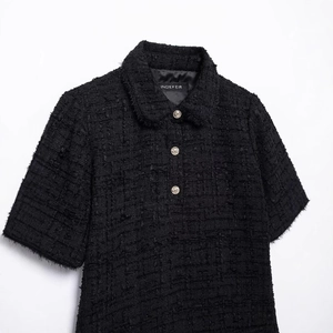 Chic black tweed short-sleeve dress with elegant gold buttons and fringe details