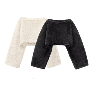 Detailed texture of black and cream faux fur cropped tops with fluffy plush finish