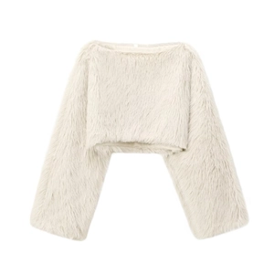Close-up of fluffy cream faux fur crop top showing soft texture and shaggy fiber detail
