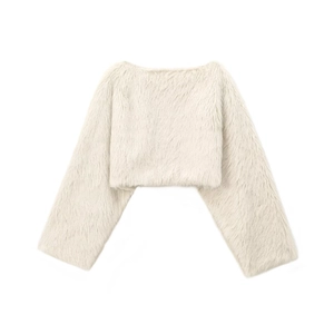 Close-up of ivory faux fur texture on a soft cropped jacket for autumn fashion