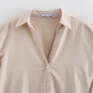 Minimalist beige linen shirt with lapel collar and pearlescent buttons for women
