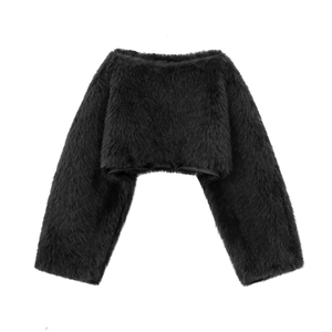 Detailed close-up of soft black faux fur texture on this cropped long-sleeve jacket