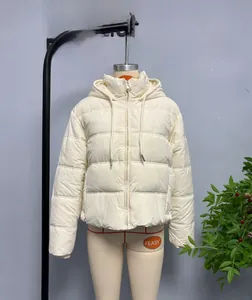 Detail of white hooded quilted jacket featuring horizontal stitching and zipper closure