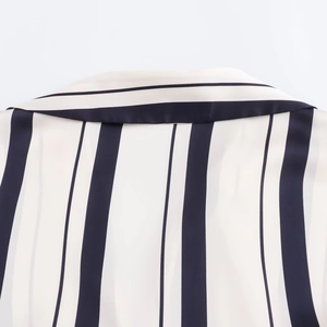 Detail of the back neckline and collar on a white navy striped satin texture shirt