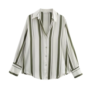 Detail of olive green vertical stripes and button cuffs on the satin-textured shirt