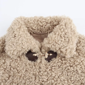 Chic women's autumn fleece jacket featuring toggle closures and textured faux fur
