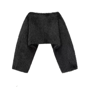 Detailed macro view of black faux fur texture and lining on this stylish short bolero shrug