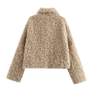 Women street fashion beige faux shearling fleece jacket with lapel collar in a short cut