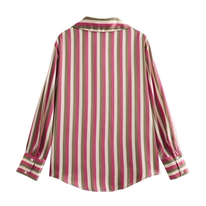 Detail view of the back of a women's satin shirt with vertical stripes and curved hem