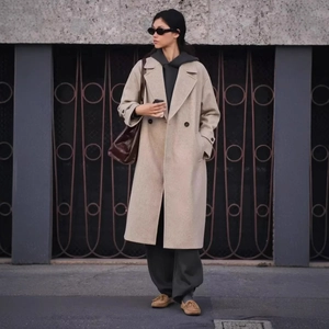 Women's oatmeal double-breasted long wool coat with classic lapels and straight silhouette