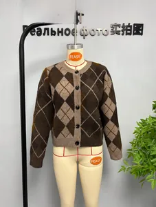 Detailed close-up of brown argyle knit cardigan featuring a round neck and classic buttons