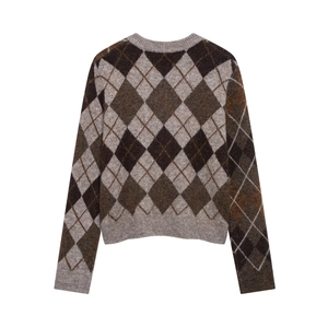 Detail of classic argyle pattern knit sweater with brown and grey diamond texture